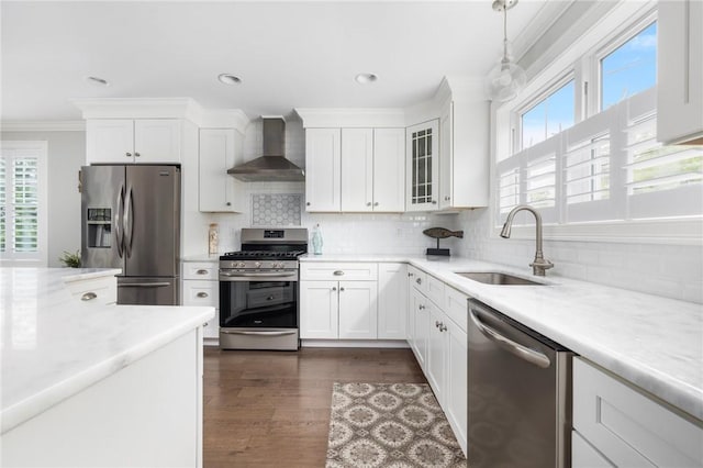 36 Wanda St, Narragansett, RI 02882 - kitchen featuring appliances with stainless steel finishes, wall chimney exhaust hood, a sink, light countertops, and plenty of natural light