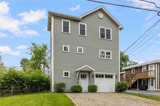 36 Wanda St, Narragansett, RI 02882 - view of front of property with gravel driveway, an attached garage, a front yard, and stairs
