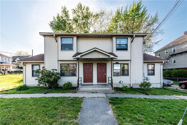 12 NE St, Woonsocket, RI 02895 - view of front facade with a front lawn