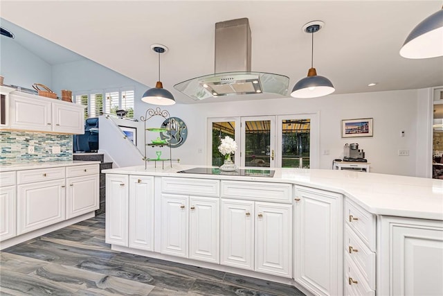 48 Wright Ln, Jamestown, RI 02835 - kitchen featuring island range hood, black electric stovetop, decorative backsplash, light countertops, and white cabinets