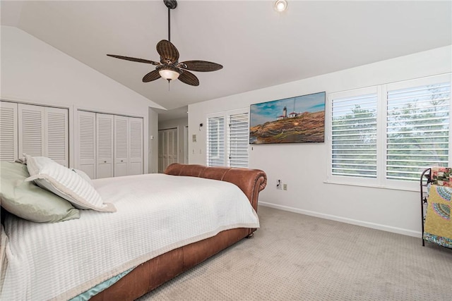 48 Wright Ln, Jamestown, RI 02835 - carpeted bedroom featuring vaulted ceiling, two closets, baseboards, and ceiling fan