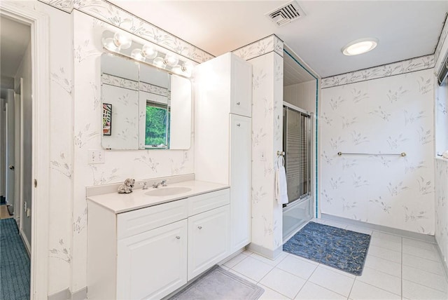 48 Wright Ln, Jamestown, RI 02835 - bathroom featuring vanity, shower / bath combination with glass door, tile patterned floors, baseboards, and wallpapered walls