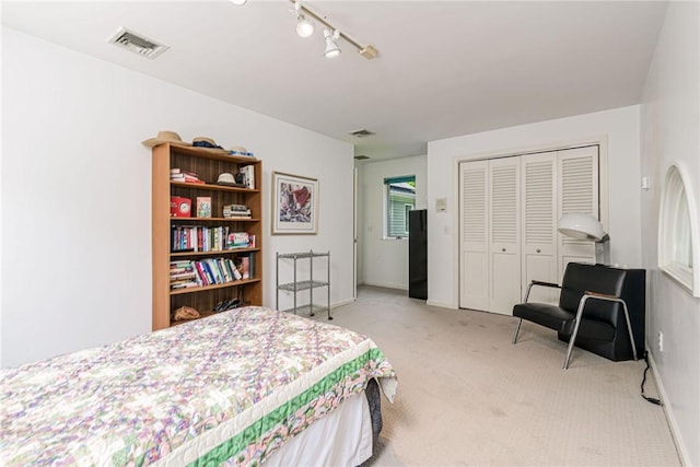 48 Wright Ln, Jamestown, RI 02835 - bedroom featuring light carpet, a closet, baseboards, and rail lighting