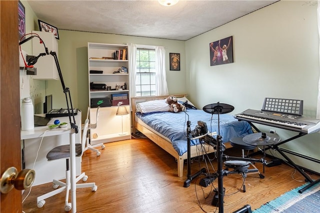 850 Black Plain Rd, North Smithfield, RI 02896 - bedroom with wood finished floors and a textured ceiling