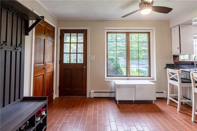 850 Black Plain Rd, North Smithfield, RI 02896 - mudroom with a baseboard heating unit, ceiling fan, ornamental molding, and brick patterned floors