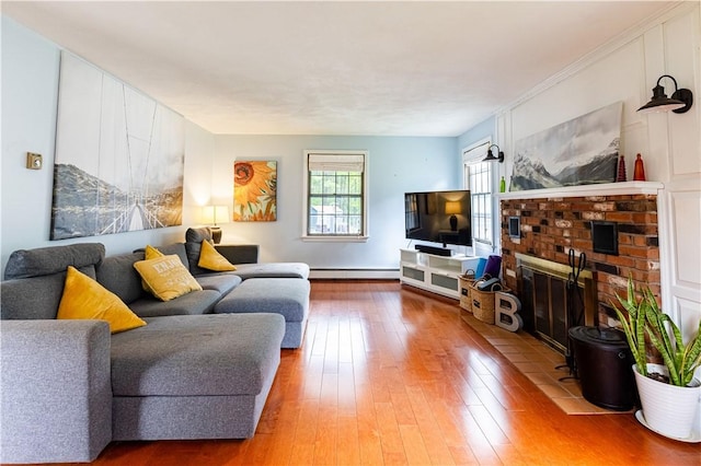 850 Black Plain Rd, North Smithfield, RI 02896 - living area with baseboard heating, hardwood / wood-style flooring, and a brick fireplace