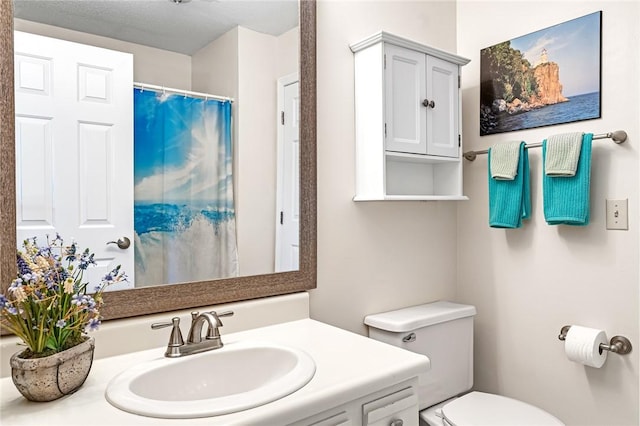 565 Quaker Ln Unit 43, West Warwick, RI 02893 - full bathroom featuring vanity, toilet, and a shower with curtain