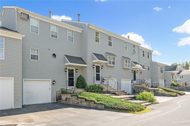 565 Quaker Ln Unit 43, West Warwick, RI 02893 - view of front of home featuring a garage, driveway, and a residential view