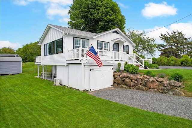 6 Dolphin Rd, Narragansett, RI 02882 - view of front of house featuring a front yard, a porch, and stairway