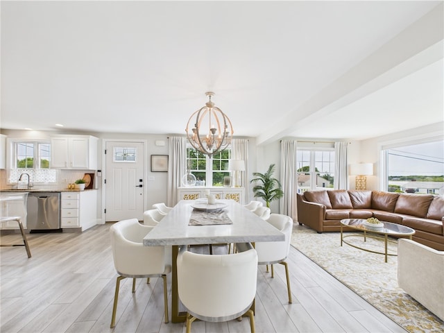 6 Dolphin Rd, Narragansett, RI 02882 - dining space with a chandelier, plenty of natural light, and light wood-type flooring