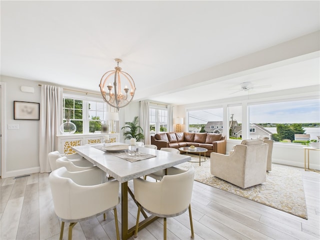 6 Dolphin Rd, Narragansett, RI 02882 - dining space with a chandelier, light wood-type flooring, baseboards, and ceiling fan