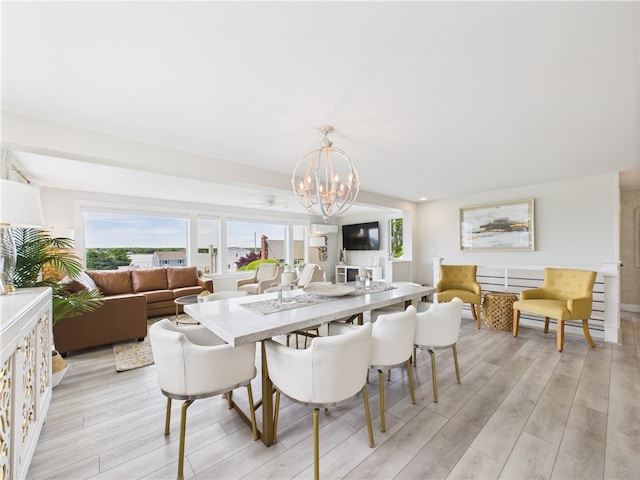6 Dolphin Rd, Narragansett, RI 02882 - dining space featuring a chandelier and light wood-style flooring