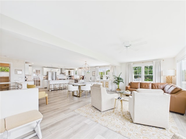 6 Dolphin Rd, Narragansett, RI 02882 - living room featuring ceiling fan, light wood-style flooring, and a chandelier