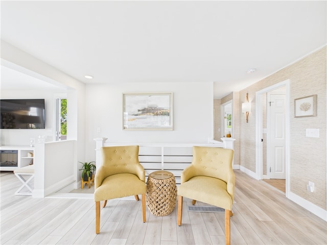 6 Dolphin Rd, Narragansett, RI 02882 - sitting room with baseboards, plenty of natural light, and light wood-style floors