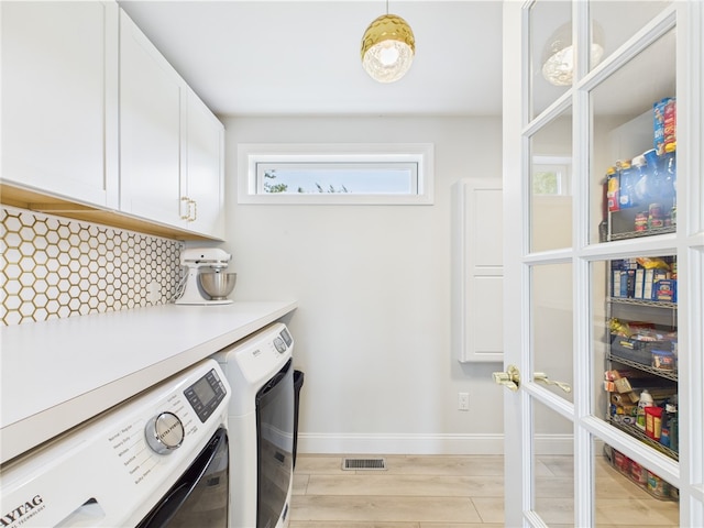 6 Dolphin Rd, Narragansett, RI 02882 - washroom with cabinet space, washing machine and clothes dryer, light wood-style flooring, and baseboards