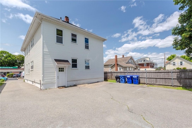412 E Ave, Pawtucket, RI 02860 - rear view of property with a chimney and a patio