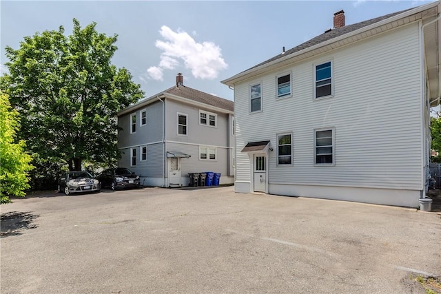 412 E Ave, Pawtucket, RI 02860 - rear view of house with a chimney
