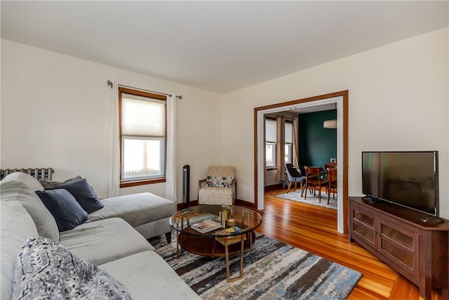 412 E Ave, Pawtucket, RI 02860 - living area with light wood-type flooring and a wall unit AC