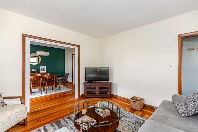 412 E Ave, Pawtucket, RI 02860 - living area featuring wood finished floors, baseboards, and a wall mounted AC