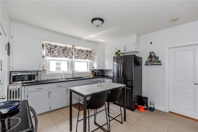412 E Ave, Pawtucket, RI 02860 - kitchen featuring appliances with stainless steel finishes, a sink, backsplash, dark countertops, and open shelves