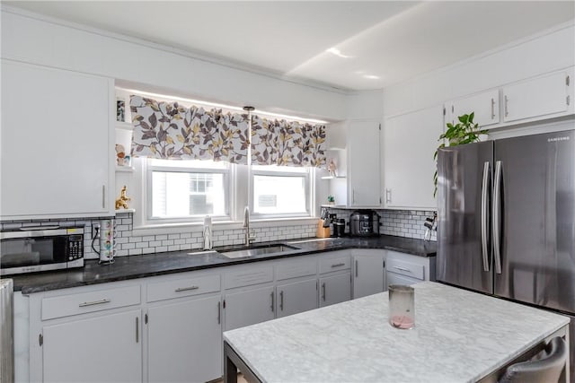 412 E Ave, Pawtucket, RI 02860 - kitchen featuring open shelves, appliances with stainless steel finishes, a sink, backsplash, and white cabinets