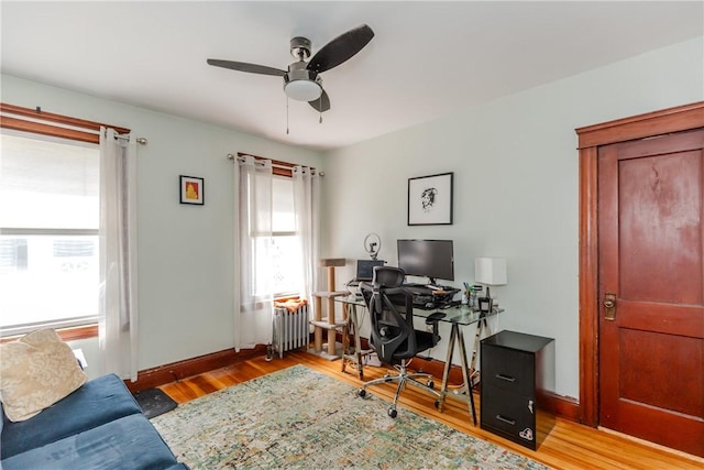 412 E Ave, Pawtucket, RI 02860 - office area with radiator heating unit, wood finished floors, baseboards, and a ceiling fan