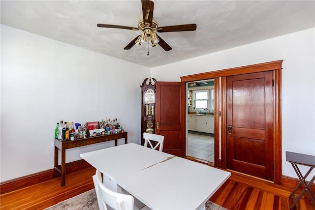 412 E Ave, Pawtucket, RI 02860 - dining room with wood finished floors, a ceiling fan, and baseboards