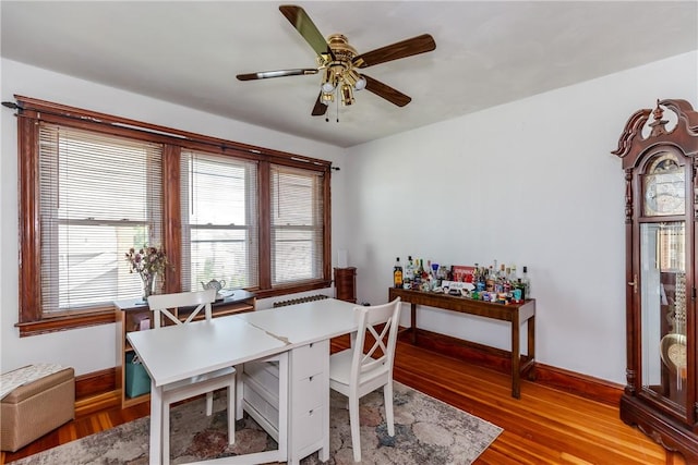 412 E Ave, Pawtucket, RI 02860 - dining room featuring baseboards, ceiling fan, and light wood-type flooring