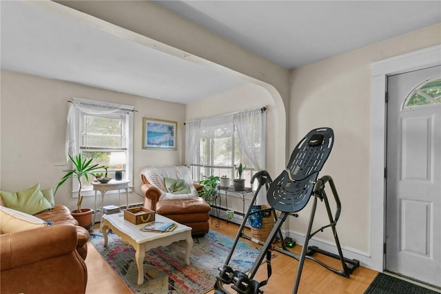 99 Third St, West Warwick, RI 02893 - living room with plenty of natural light, wood finished floors, and baseboards