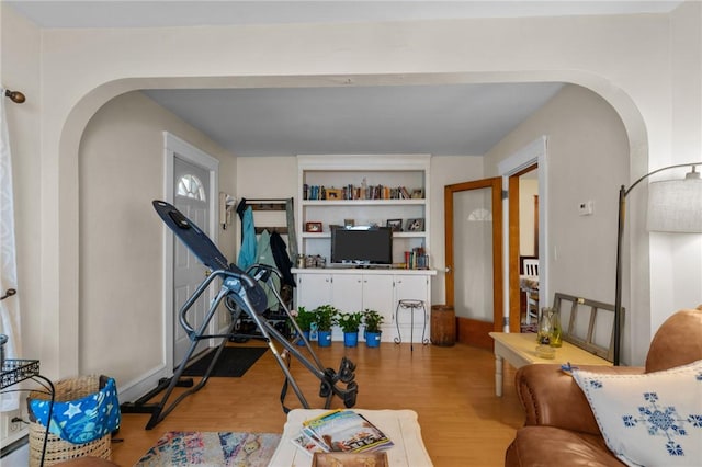 99 Third St, West Warwick, RI 02893 - workout area featuring arched walkways, light wood-style floors, and built in features