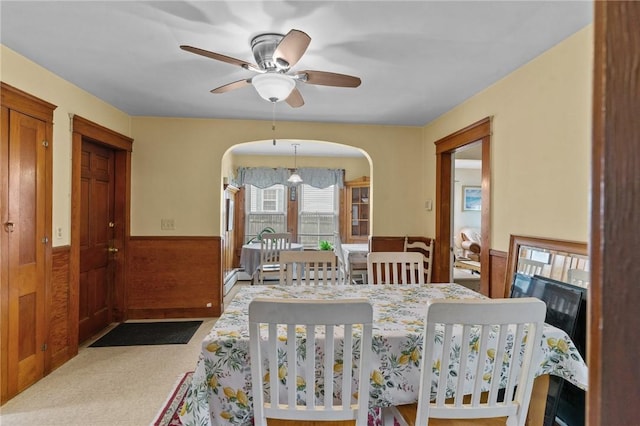 99 Third St, West Warwick, RI 02893 - carpeted dining room with ceiling fan, arched walkways, and wainscoting
