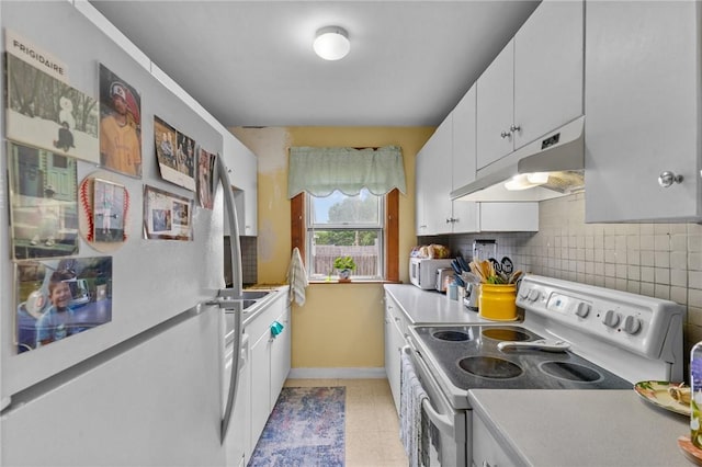 99 Third St, West Warwick, RI 02893 - kitchen featuring white appliances, under cabinet range hood, decorative backsplash, white cabinets, and light countertops