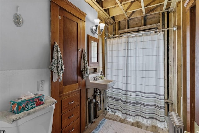 99 Third St, West Warwick, RI 02893 - full bathroom featuring radiator, toilet, curtained shower, and a sink