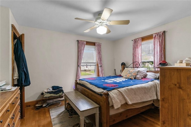 99 Third St, West Warwick, RI 02893 - bedroom featuring wood finished floors, multiple windows, a ceiling fan, and baseboards