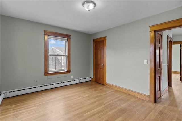 99 Third St, West Warwick, RI 02893 - empty room featuring a baseboard radiator, light wood-style flooring, and baseboards