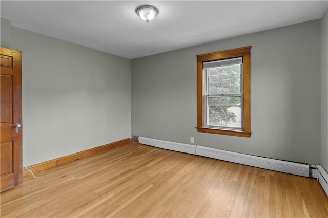 99 Third St, West Warwick, RI 02893 - unfurnished room featuring baseboards, a baseboard heating unit, and light wood-style flooring