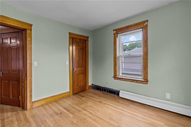99 Third St, West Warwick, RI 02893 - empty room with light wood-style flooring and baseboards