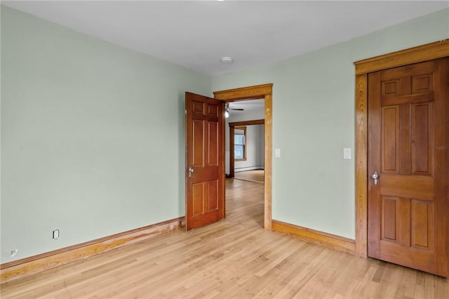 99 Third St, West Warwick, RI 02893 - unfurnished room featuring baseboards, light wood-type flooring, a baseboard radiator, and a smoke detector