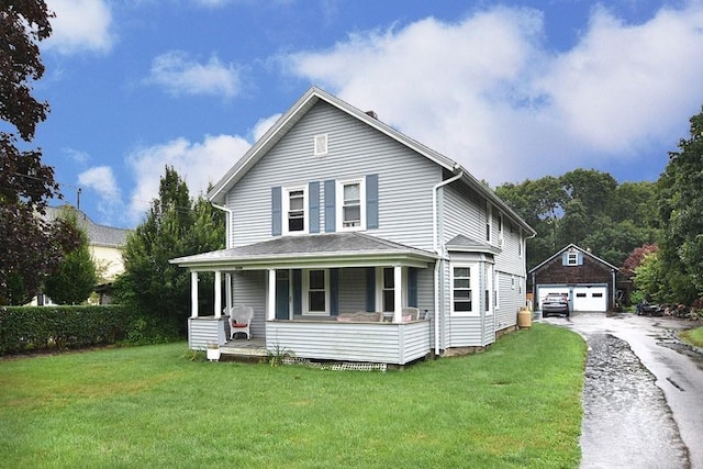 3506 Kingstown Rd, South Kingstown, RI 02892 - view of front of home with covered porch, a garage, an outdoor structure, and a front lawn