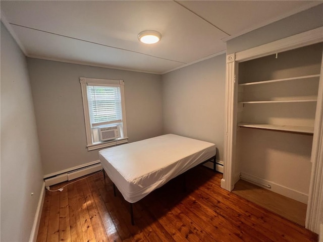 3506 Kingstown Rd, South Kingstown, RI 02892 - bedroom featuring a baseboard heating unit, crown molding, dark wood-style flooring, baseboards, and cooling unit