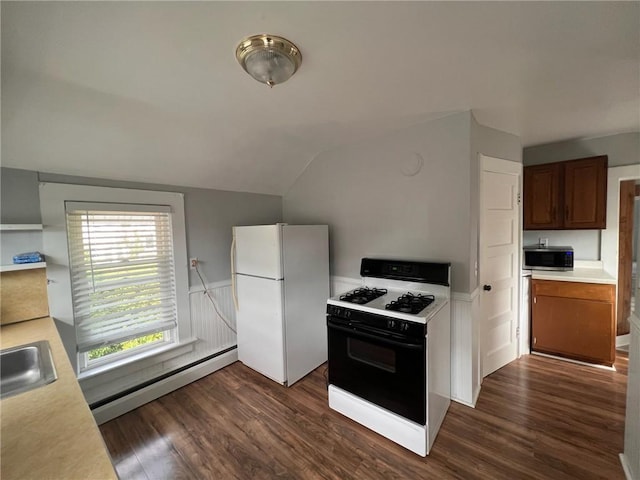 3506 Kingstown Rd, South Kingstown, RI 02892 - kitchen with gas stove, a baseboard heating unit, freestanding refrigerator, stainless steel microwave, and light countertops