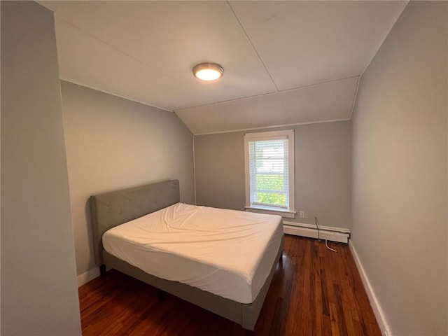 3506 Kingstown Rd, South Kingstown, RI 02892 - bedroom with baseboard heating, vaulted ceiling, dark wood finished floors, and baseboards