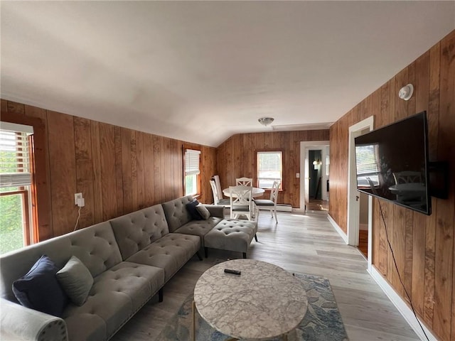 3506 Kingstown Rd, South Kingstown, RI 02892 - living area with wooden walls, plenty of natural light, light wood-style floors, and lofted ceiling