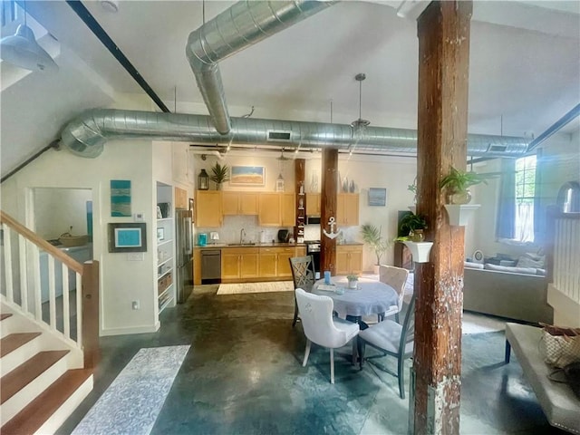28 Bayley St N Unit 107, Pawtucket, RI 02860 - dining space featuring stairs and concrete floors