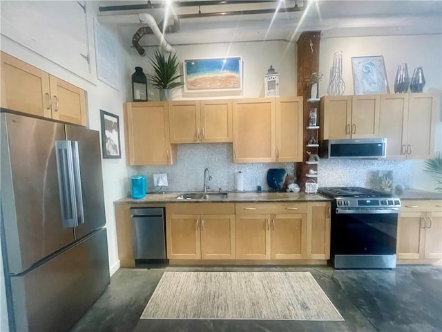 28 Bayley St N Unit 107, Pawtucket, RI 02860 - kitchen with stainless steel appliances, a sink, concrete flooring, and decorative backsplash