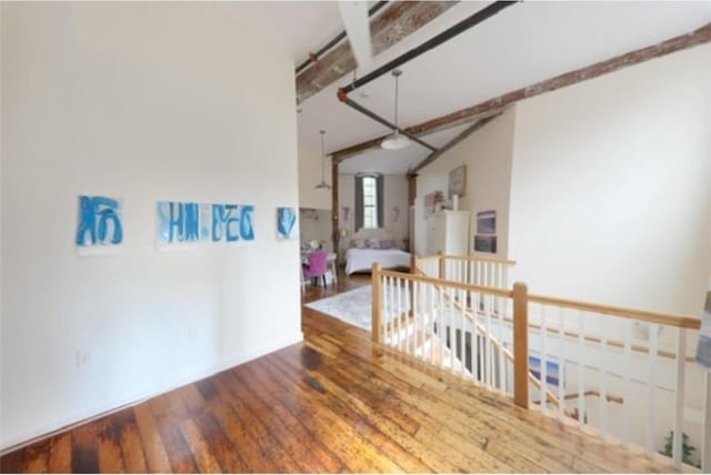 28 Bayley St N Unit 107, Pawtucket, RI 02860 - empty room featuring wood finished floors and vaulted ceiling