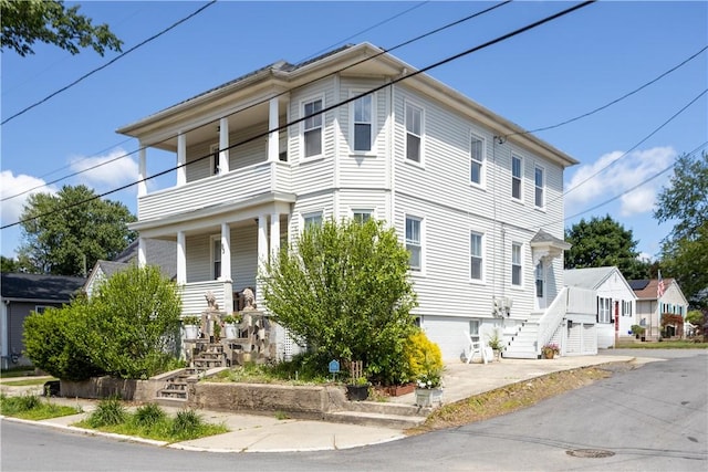 93 Naples Ave, Providence, RI 02908 - view of front of property featuring stairs, covered porch, and a balcony