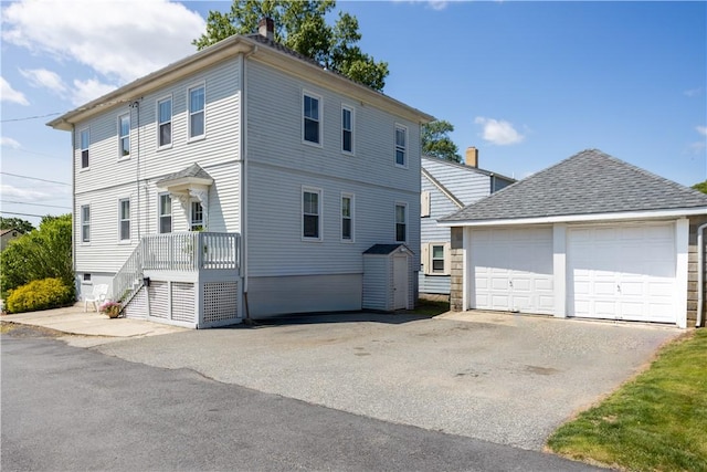 93 Naples Ave, Providence, RI 02908 - view of front of home featuring an outdoor structure and a garage