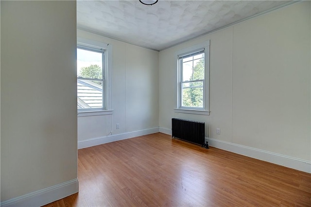 93 Naples Ave, Providence, RI 02908 - spare room with radiator heating unit, baseboards, healthy amount of natural light, and ornamental molding