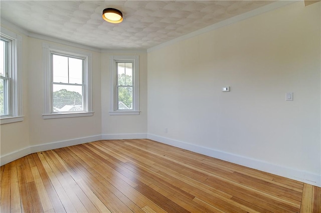 93 Naples Ave, Providence, RI 02908 - spare room featuring light wood-style flooring, baseboards, and crown molding